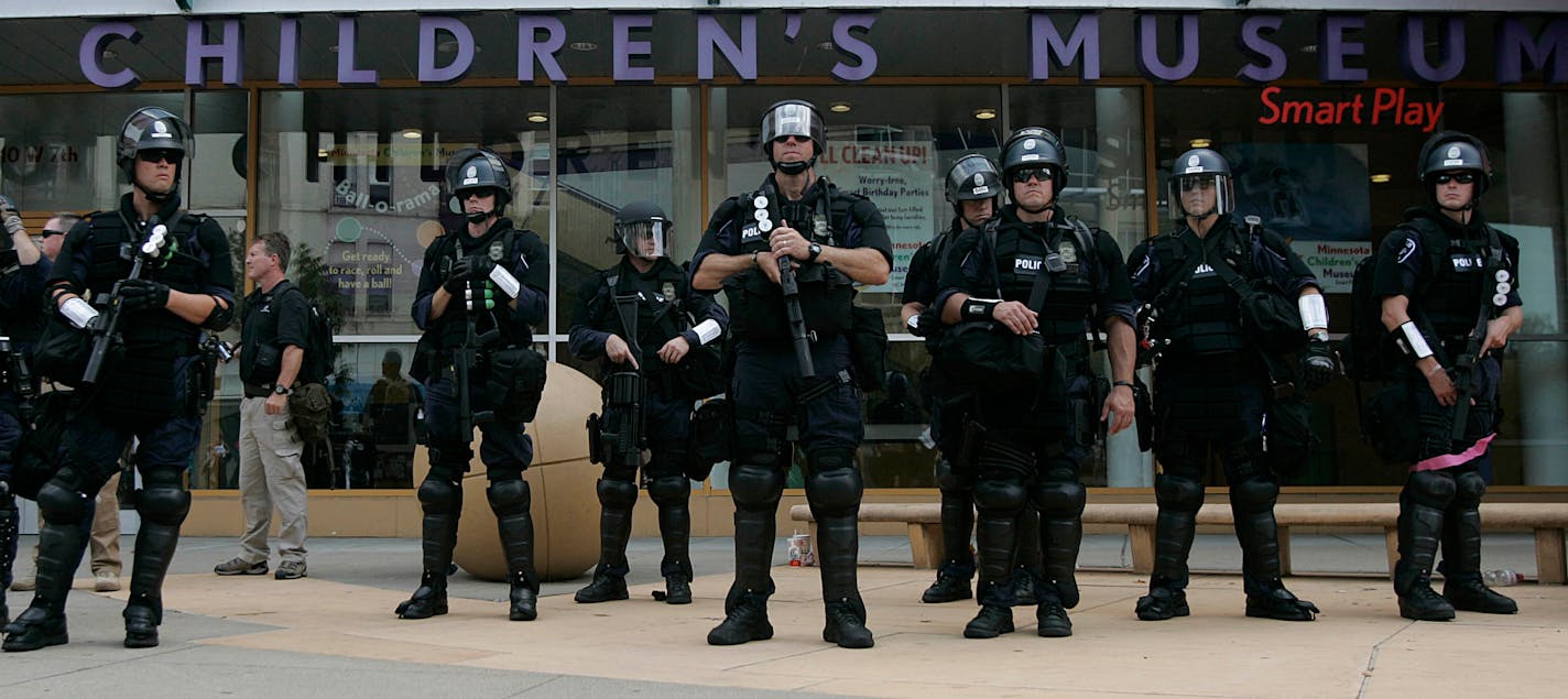 Police officers, dressed in riot gear, gathered outside the Minnesota Children's Museum in downtown St. Paul on Monday. St. Paul Mayor Chris Coleman praised the officers' overall performance.