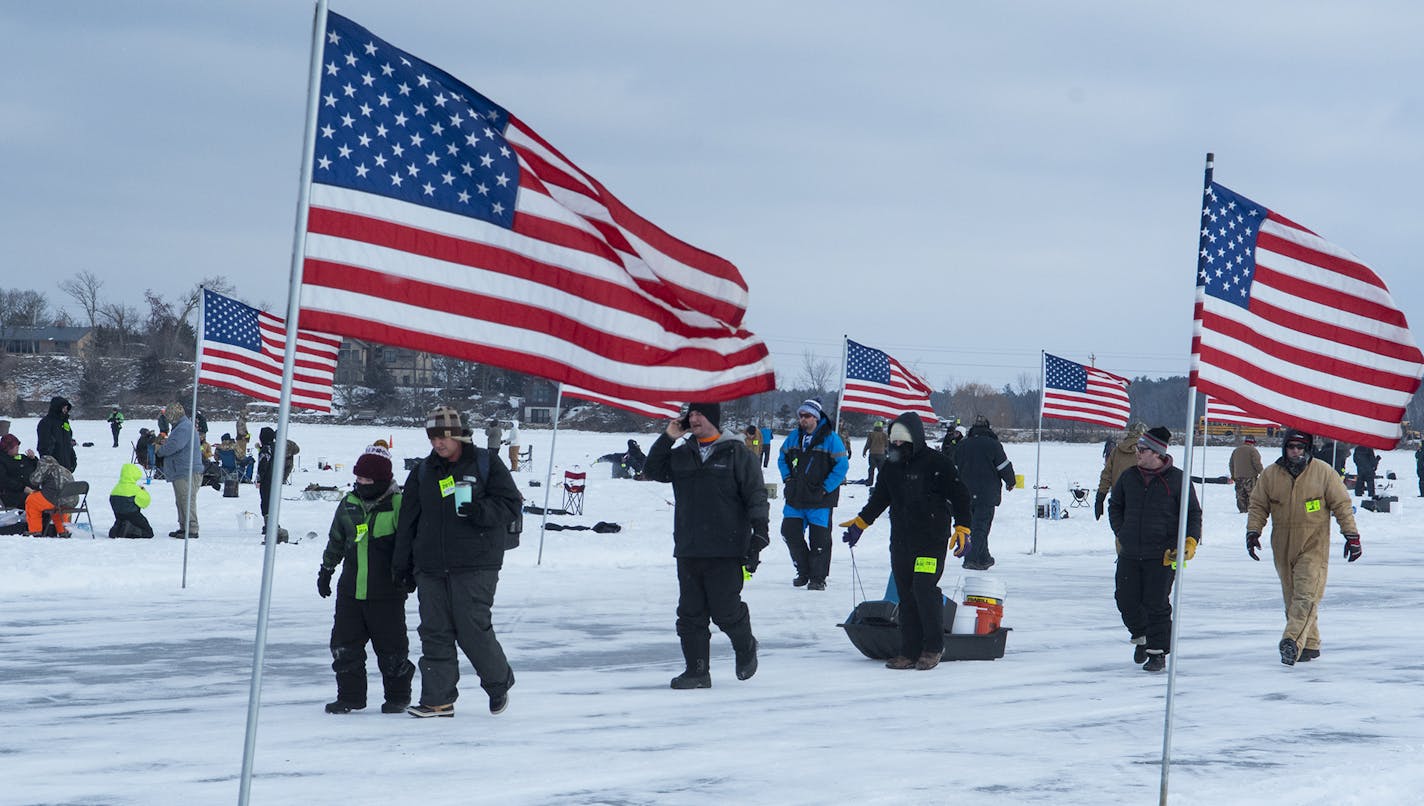 Pomp, circumstance and eye-catching methods to stay warm on a 20-degree day marked the view from ice level Saturday on Gull Lake.