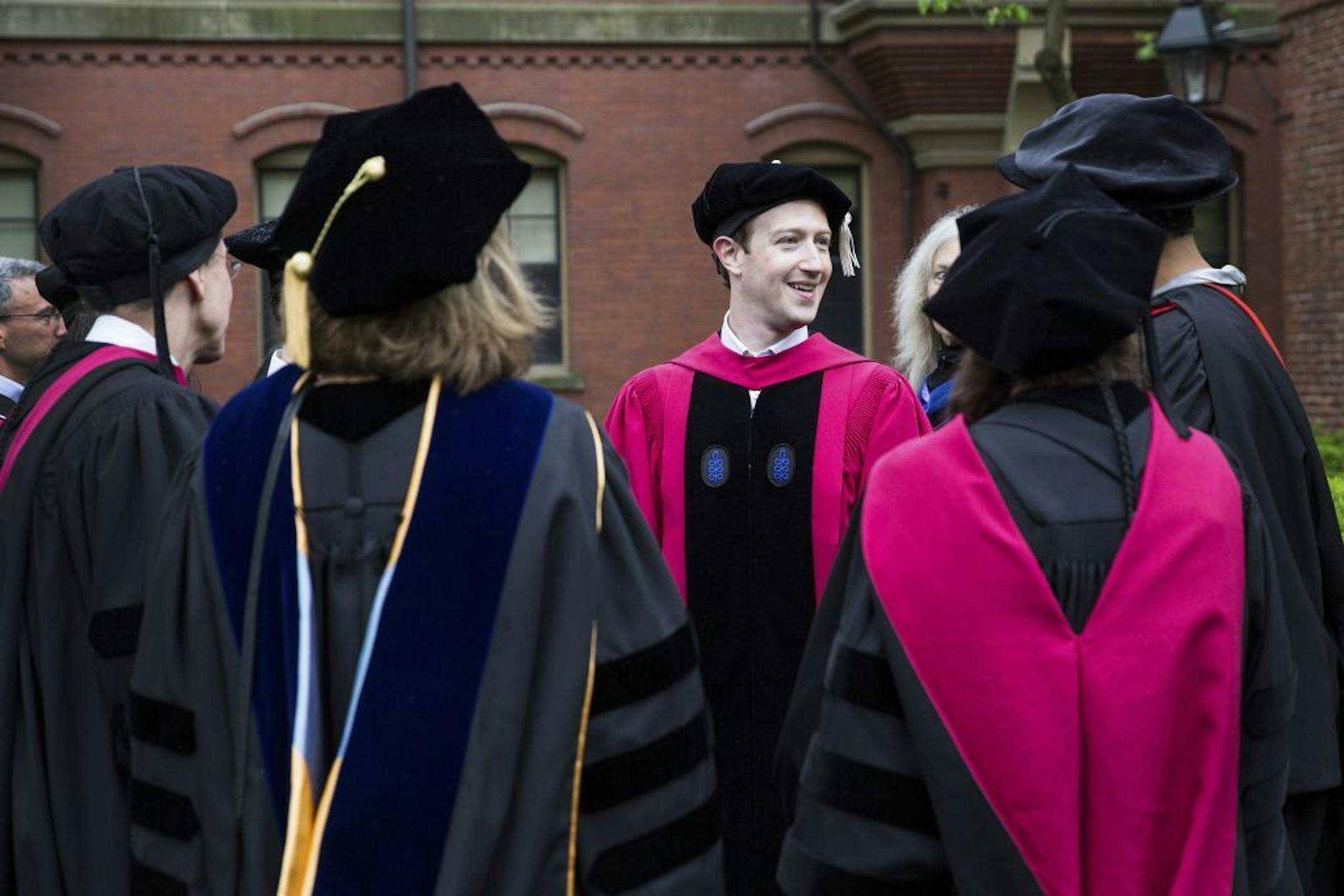 Mark Zuckerberg speaks with students during Harvard University�s 366th Commencement ceremony in Cambridge, Mass., May 25, 2017. The Facebook chief discussed how his views on how people live and work with one another had broadened, partly as a result of what he has seen on his tour around the country. �To keep our society moving forward, we have a generational challenge � to not only create new jobs, but create a renewed sense of purpose.� Harvard awarded Zuckerberg an honorary doctoral degree 12