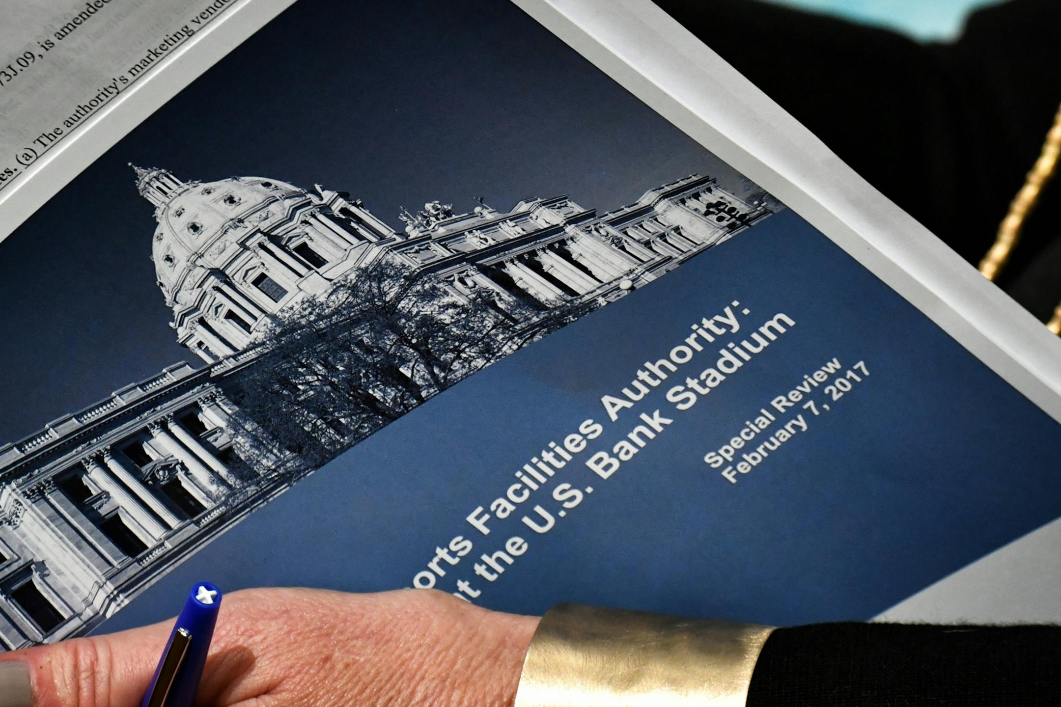 Senator Julie Rosen, author of the original stadium legislation held a copy of the report.