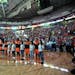 Western Conference players stand with children during the national anthem before the WNBA All-Star basketball game Saturday, July 22, 2017, in Seattle
