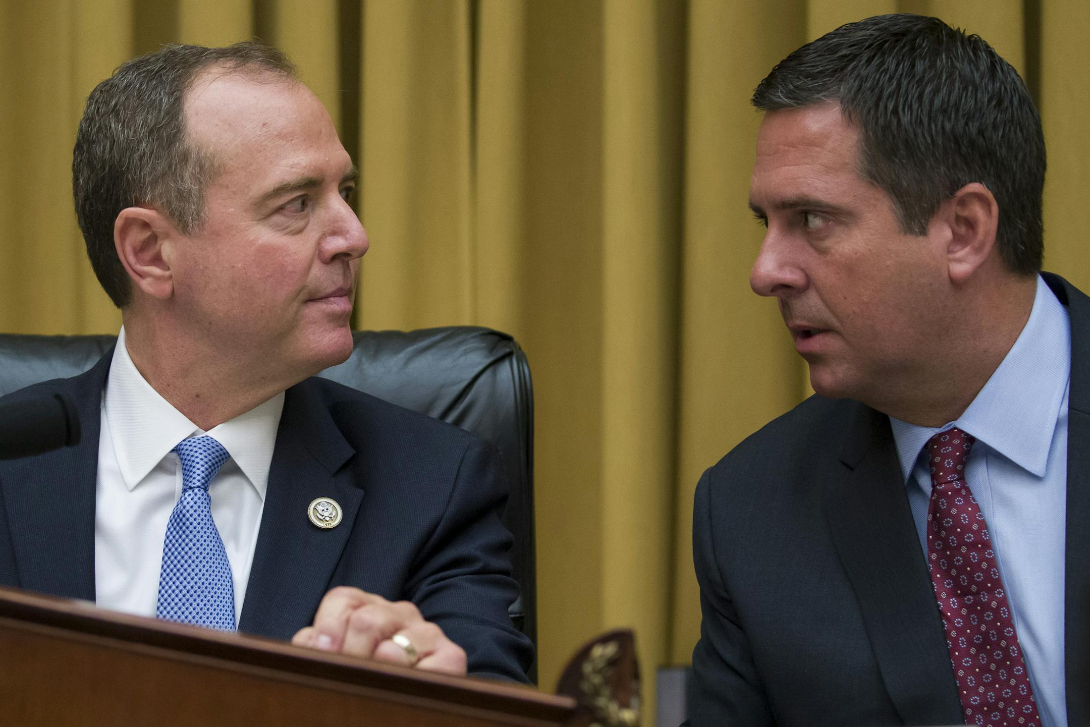 House Intelligence Committee Chairman Adam Schiff, D-Calif., and Rep. Devin Nunes, R-Calif, ranking member of the House Intelligence Committee talk before hearing testimony by former special counsel Robert Mueller before the House Intelligence Committee hearing on his report on Russian election interference, on Capitol Hill, Wednesday, July 24, 2019 in Washington. (AP Photo/Alex Brandon)