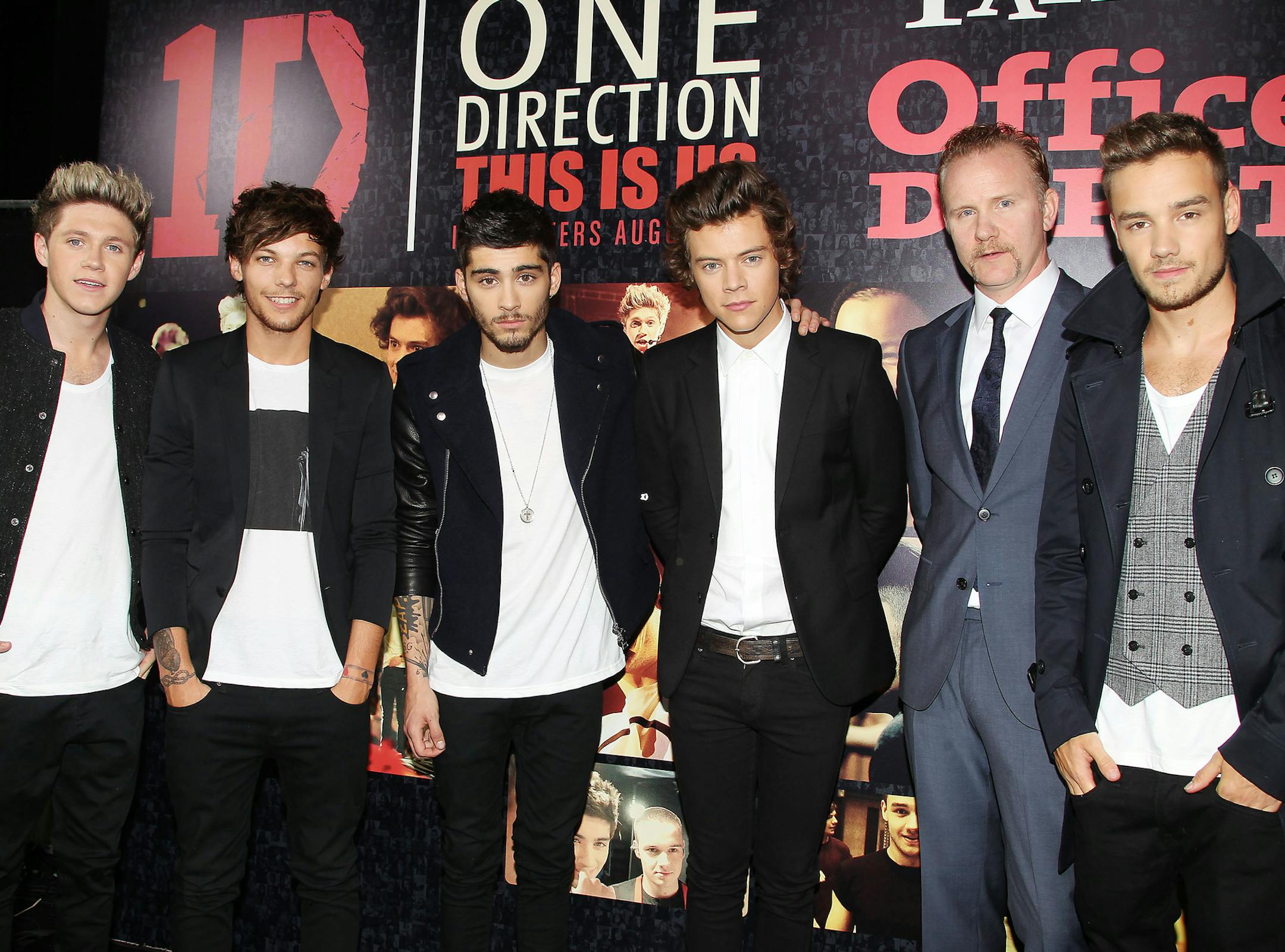This image released by Starpix shows director Morgan Spurlock, second right, with members of One Direction, from left, Niall Horan, Louis Tomlinson, Zayn Malik, Harry Styles, and Liam Payne, right, at the premiere of the film "One Direction: This Is Us," at the Ziegfeld Theatre in New York on Monday, Aug. 26, 2013. (AP Photo/Starpix, Dave Allocca) ORG XMIT: MIN2013090313332869