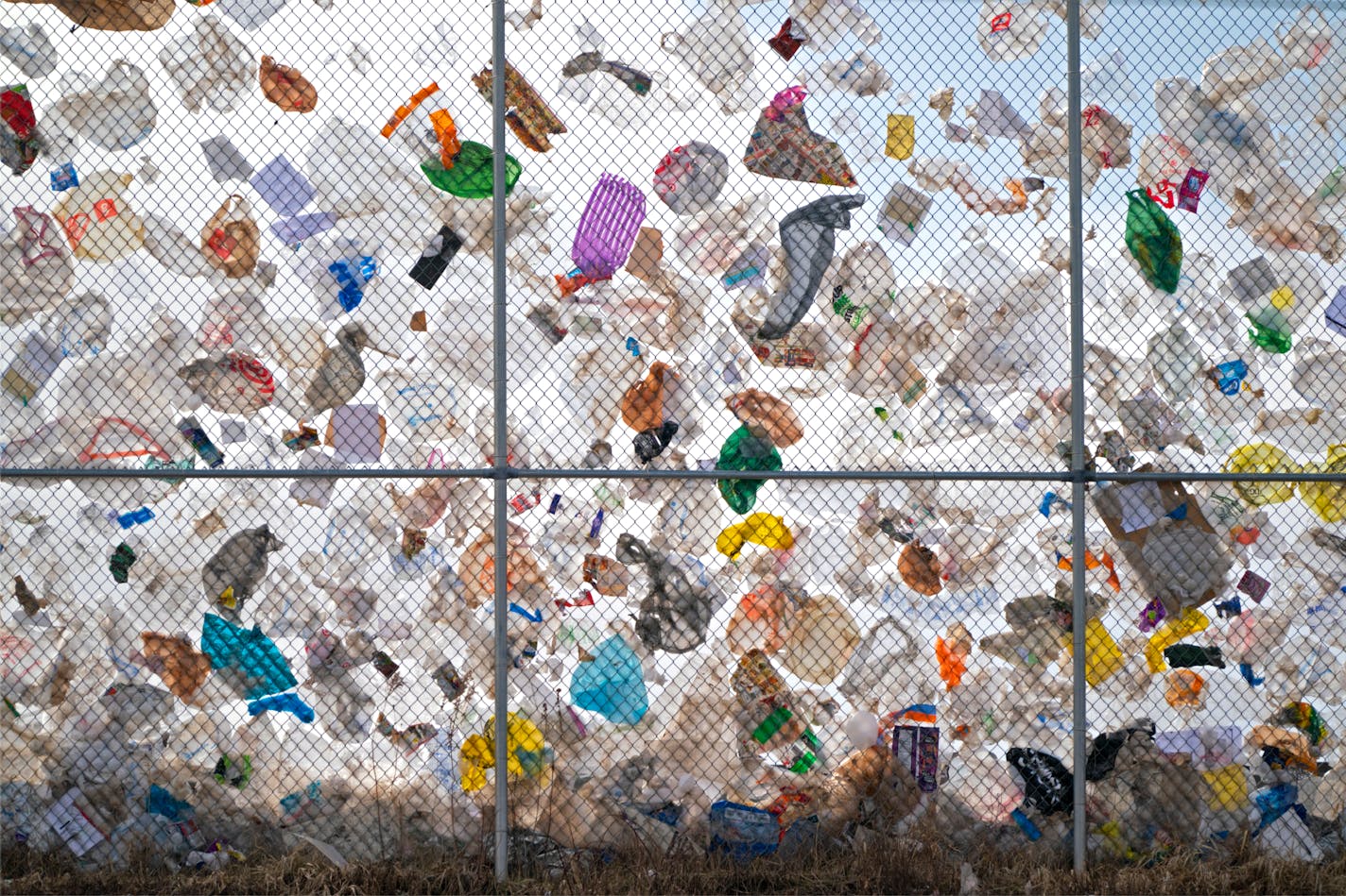 Thousands of plastic bags from the Waste Management landfill in Elk River were trapped on the perimeter fence along highway 169 as winds gusted into the 40 mph range.