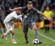 Giancarlo Gonzalez of the LA Galaxy grabbed Chase Gasper of Minnesota United in the first half.