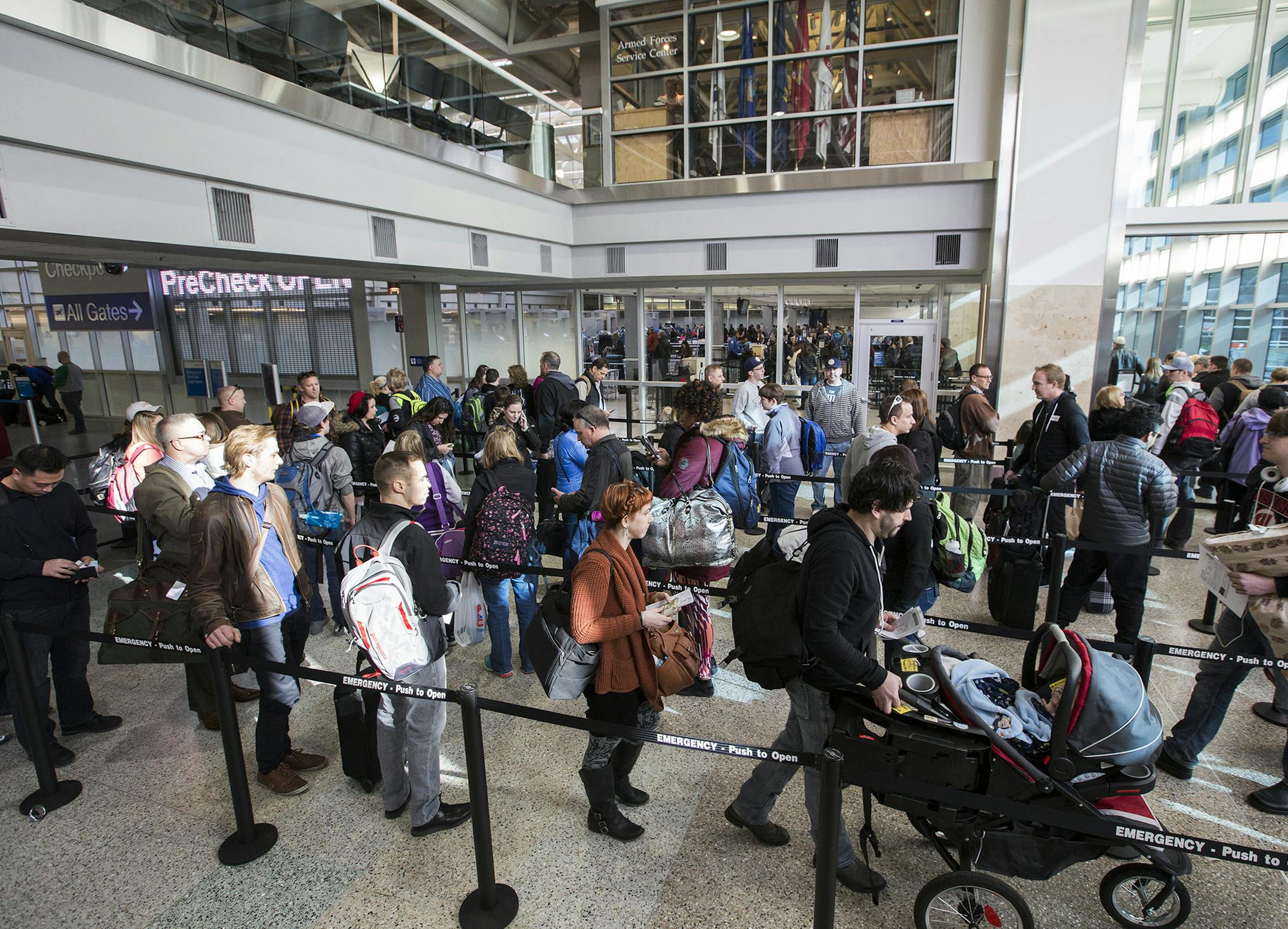 Passengers wait in line to go through the new north security checkpoint at Terminal 1 of Minneapolis-St. Paul International Airport. ] (Leila Navidi/Star Tribune) leila.navidi@startribune.com BACKGROUND INFORMATION: Friday, February 26, 2016 at Terminal 1 of Minneapolis-St. Paul International Airport. ORG XMIT: MIN1602261047171403