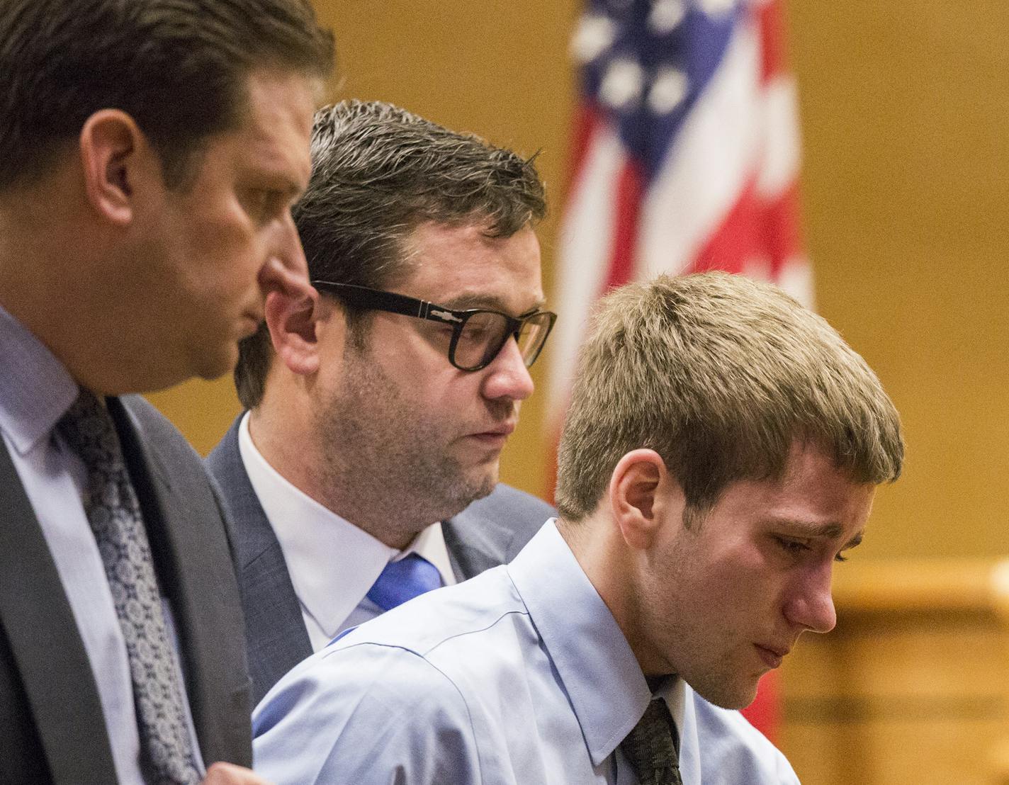 Levi Acre-Kendall walks with his lawyers Eric Nelson, center, and Doug Hazelton in Polk County Circuit Court in Balsam Lake on Friday, December 11, 2015.