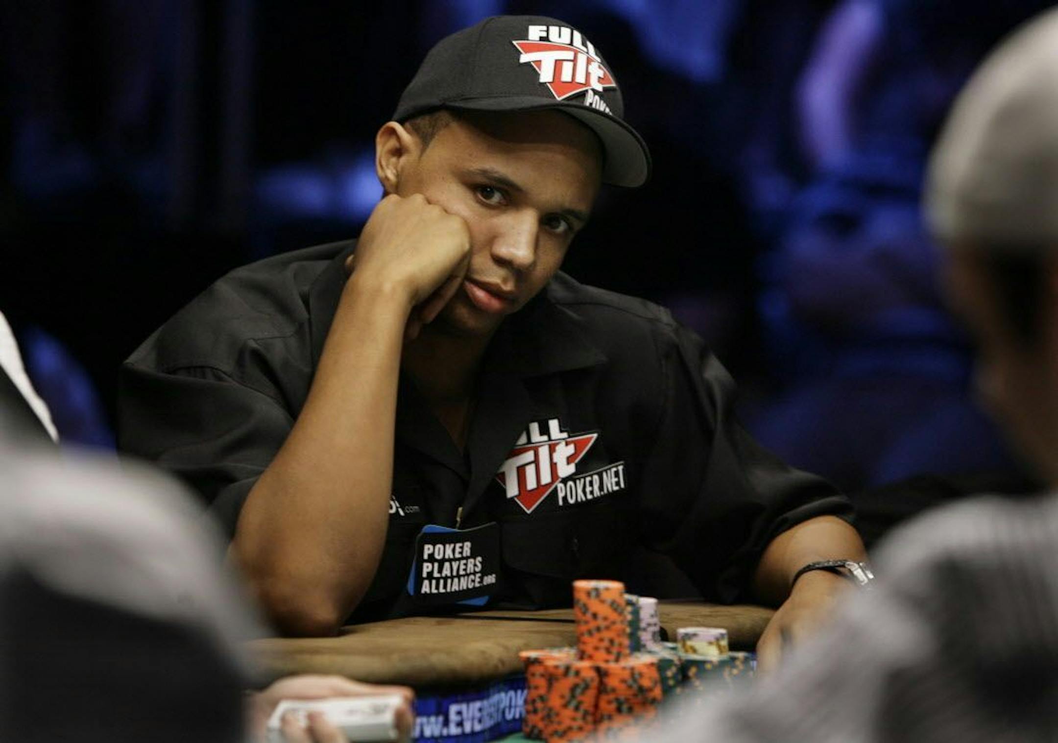 FILE - In this July 15, 2009 file photo, Phil Ivey looks up during the World Series of Poker at the Rio Hotel and Casino in Las Vegas.