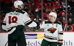 Minnesota Wild defenseman Jared Spurgeon (46) celebrates his goal with Minnesota Wild left wing Jordan Greenway (18) during the second period of an NH