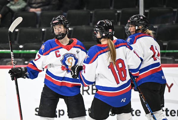 Gentry forward Ellie Sarauer (18) and defenseman Skylar Salscheider (11) celebrate with forward Cara Sajevic (7) after her second goal of the game aga