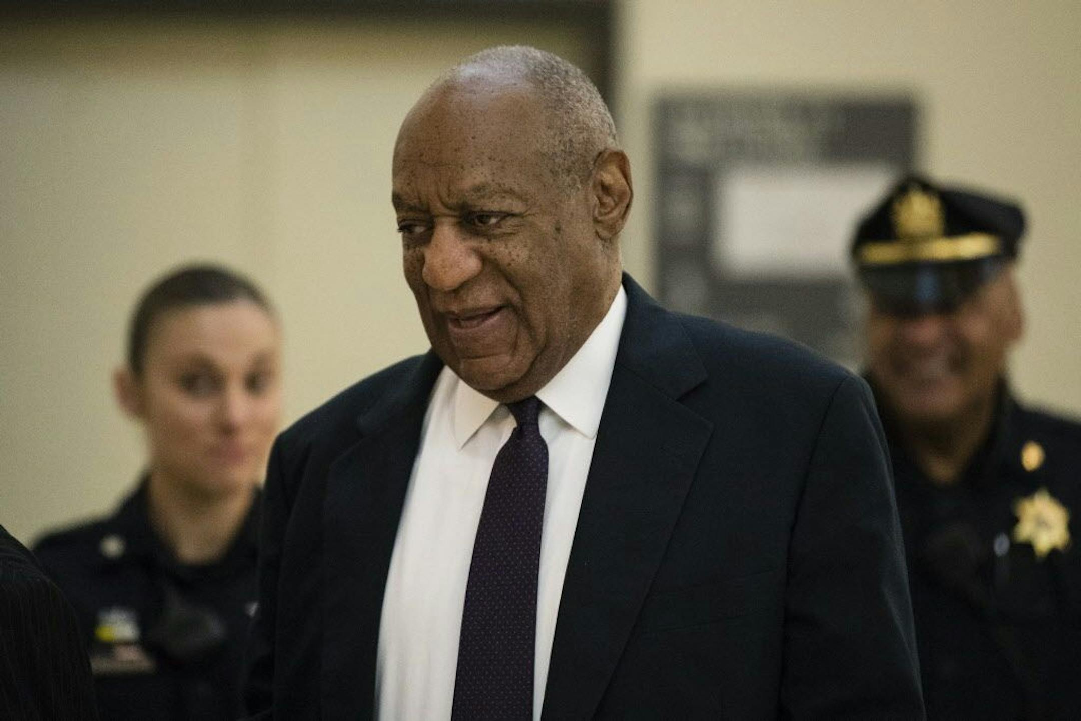 Bill Cosby walks to the courtroom during his sexual assault trial at the Montgomery County Courthouse in Norristown, Pa., Tuesday, June 6, 2017.
