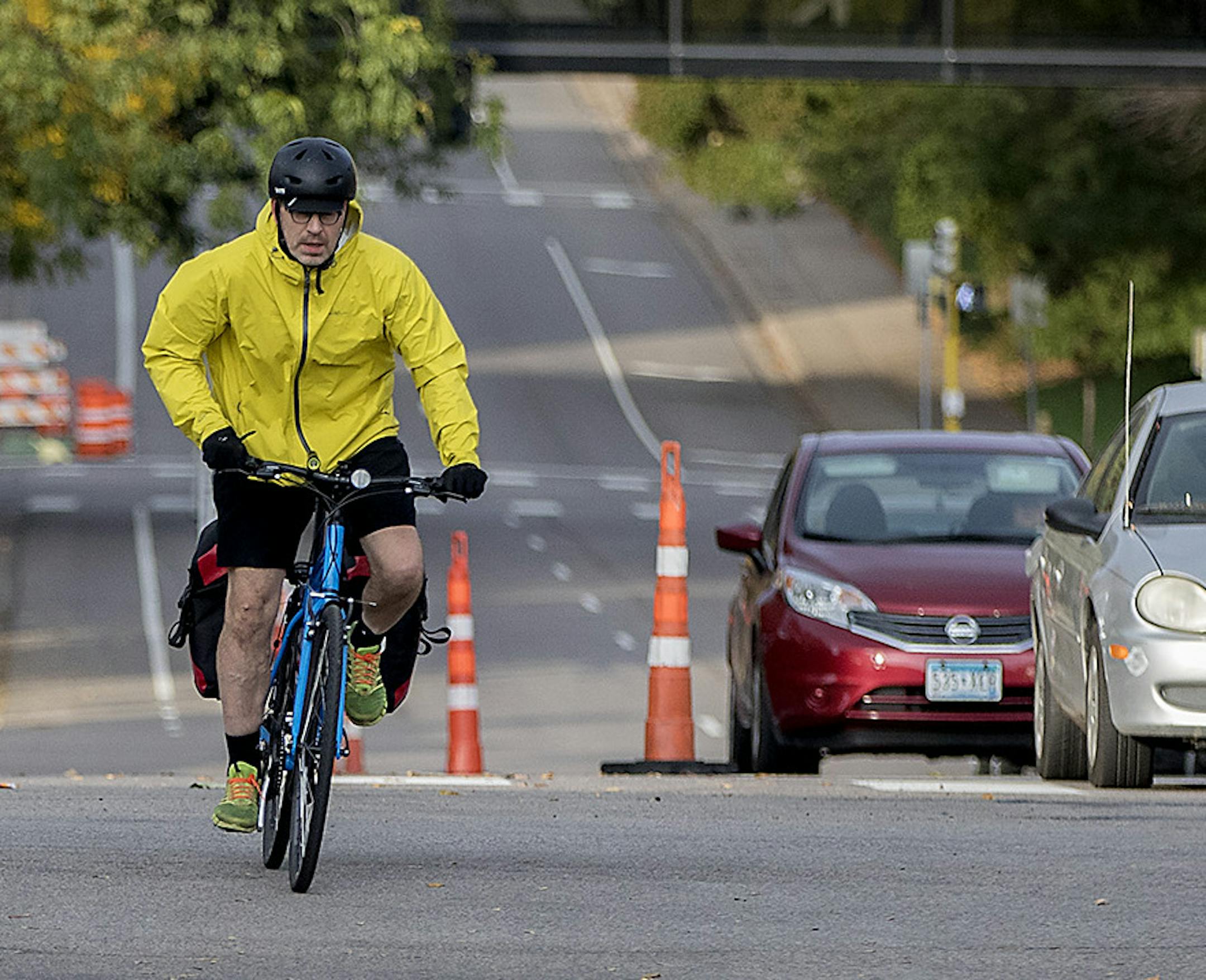 A bicyclist made his way up the bike lane during rush hour near Portland Avenue and 26th Street, Friday, October 13, 2017 in Minneapolis, MN. New bike lanes are cropping up around the Twin Cities, creating a divide between cyclists who feel safer riding in a lane and motorists, residents and business owners frustrated by lost space for driving and parking. Many of the lanes have been added within the last five years, as a result of comprehensive bicycle master plans in both Minneapolis and St. P