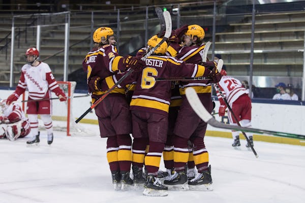 Minnesota players celebrate a goal against Wisconsin during the championship game of the Big Ten men's hockey tournament Tuesday, March 16, 2021, in S