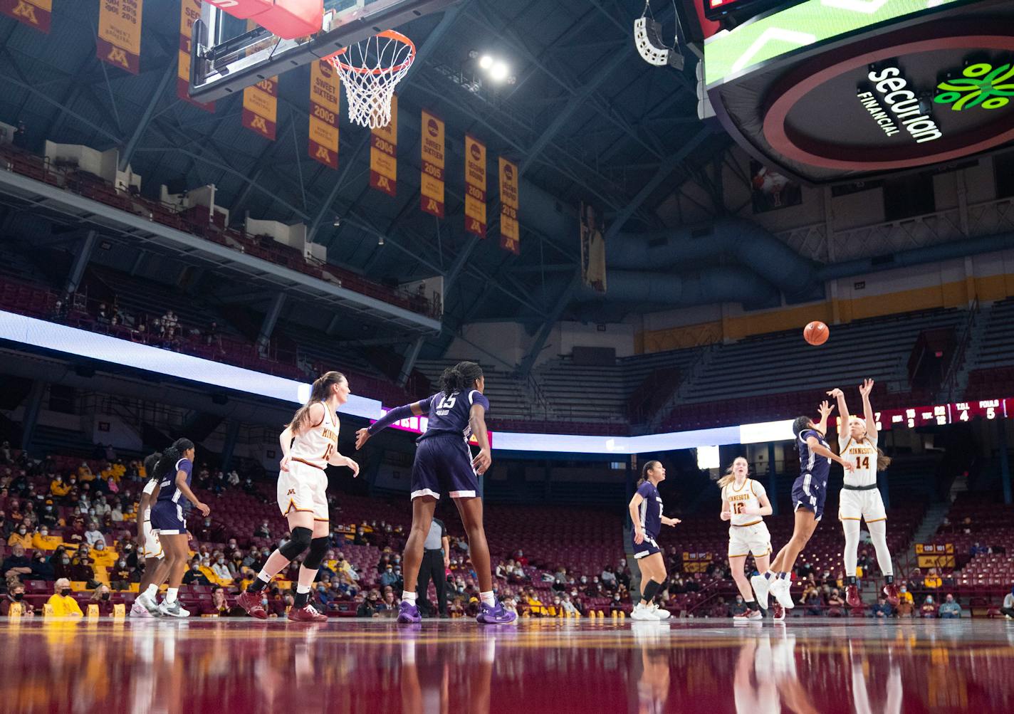 Minnesota Golden Gophers guard Sara Scalia (14) pulls up for a three point shot over Northwestern Wildcats guard Laya Hartman (33) in the second quarter Friday, Feb. 11, 2022 at Williams Arena in Minneapolis, Minn. ]