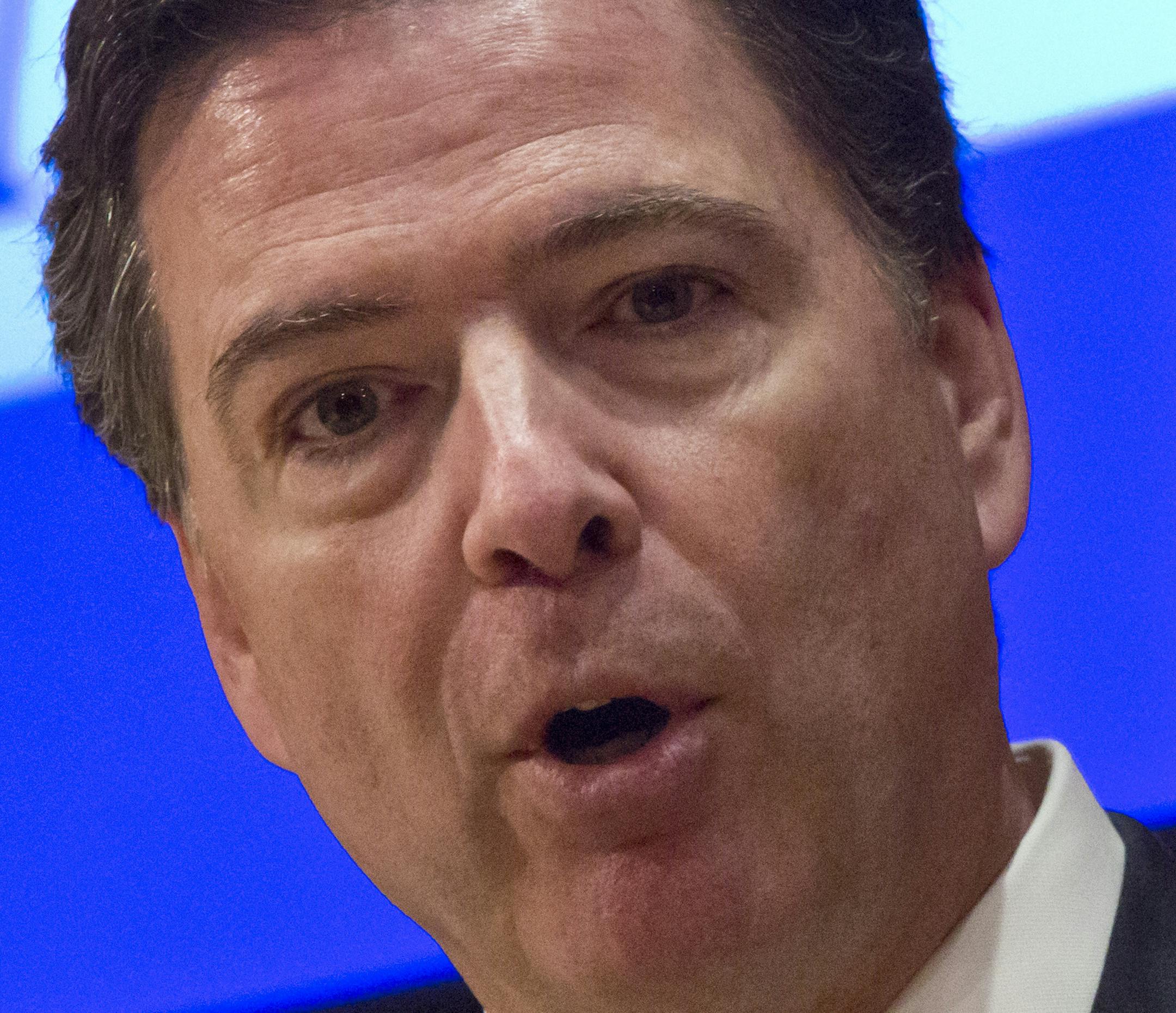 FBI Director James Comey speaks during a press conference after addressing the NYPD Shield Conference at NYPD headquarters, Wednesday, Dec. 16, 2015, in New York. Comey says the husband-and-wife team who killed 14 and wounded 21 others this month in San Bernardino, California, exchanged private direct messages and there has been no evidence to suggest the couple posted on social media. (AP Photo/Bebeto Matthews)