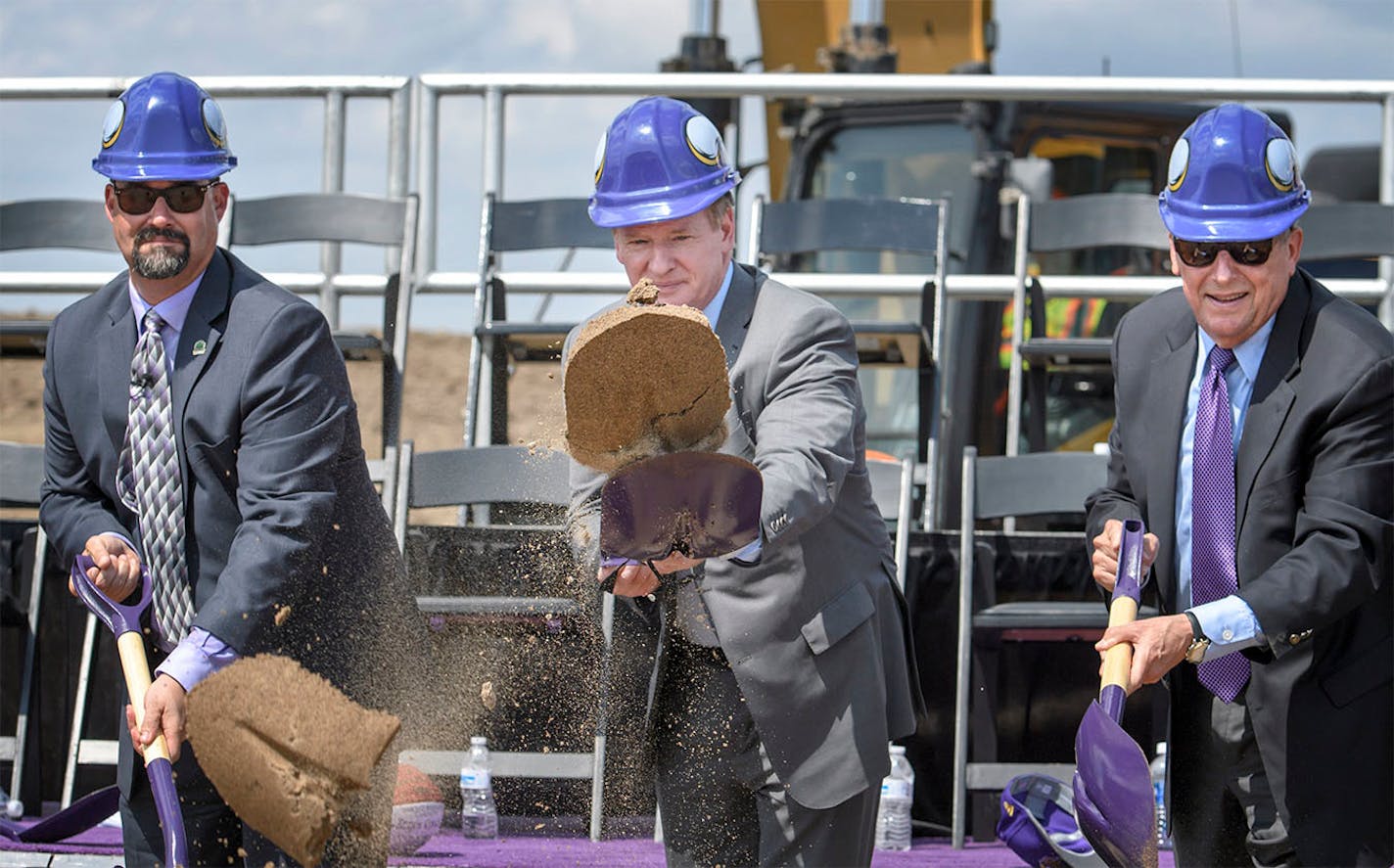 NFL Commissioner Roger Goodell, center, threw a shovelful of sand during the ceremony along with City of Eagan Mayor Mike Maguire, left and Lenny Wilf, right.