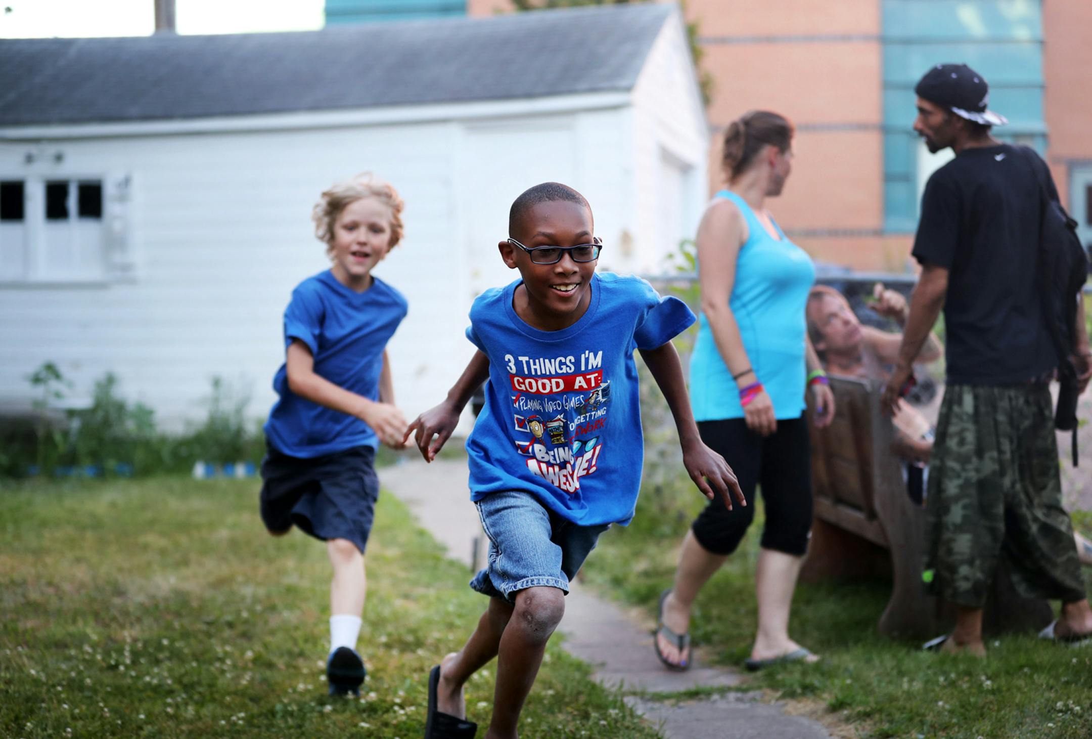 Josh Barker, front, plays with neighbor Jacob Van Sickle, left on Colfax Av. in north Minneapolis.