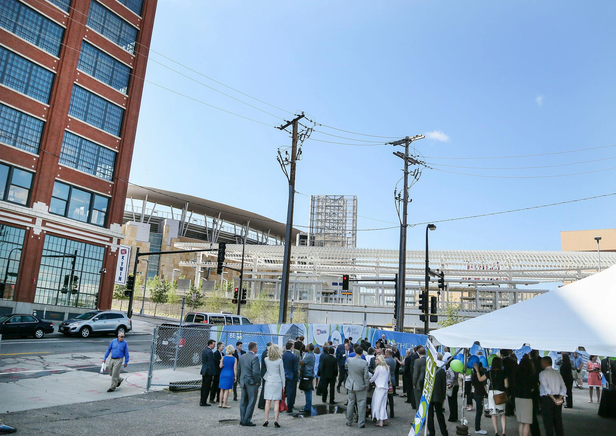 Groundbreaking for Be The Match, a $60 million office building planned for the North Loop Tuesday, July 9, 2014, in Minneapolis, MN. The Ford Building, left, Target Field, center, and Target Field Station, right, are visible in the photo.] (DAVID JOLES/STARTRIBUNE) djoles@startribune Groundbreaking for Be The Match, a $60 million office building planned for the North Loop. The new $60 million office building for Be The Match, the National Bone Marrow donation program's headquarters, signifies a growing office presence in the North Loop.