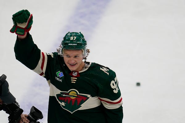 Minnesota Wild left wing Kirill Kaprizov celebrates after scoring the game-winning goal to defeat the Columbus Blue Jackets during overtime of an NHL 