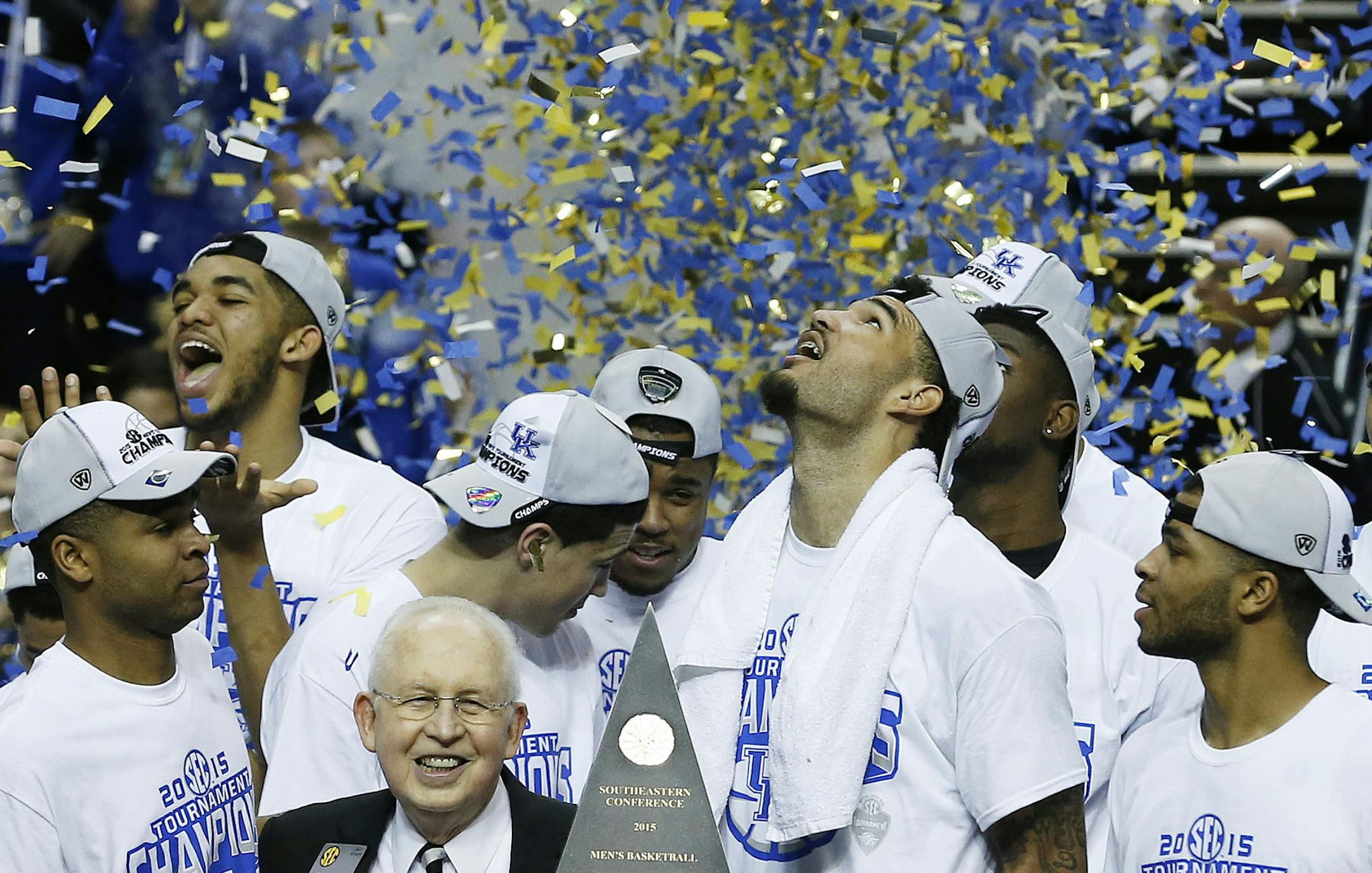 Kentucky forward Willie Cauley-Stein holds the trophy after the NCAA college basketball Southeastern Conference tournament championship game against Arkansas, Sunday, March 15, 2015, in Nashville, Tenn. Kentucky won 78-63. (AP Photo/Steve Helber)