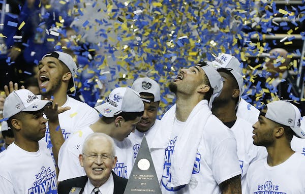 Kentucky forward Willie Cauley-Stein holds the trophy after the NCAA college basketball Southeastern Conference tournament championship game against A