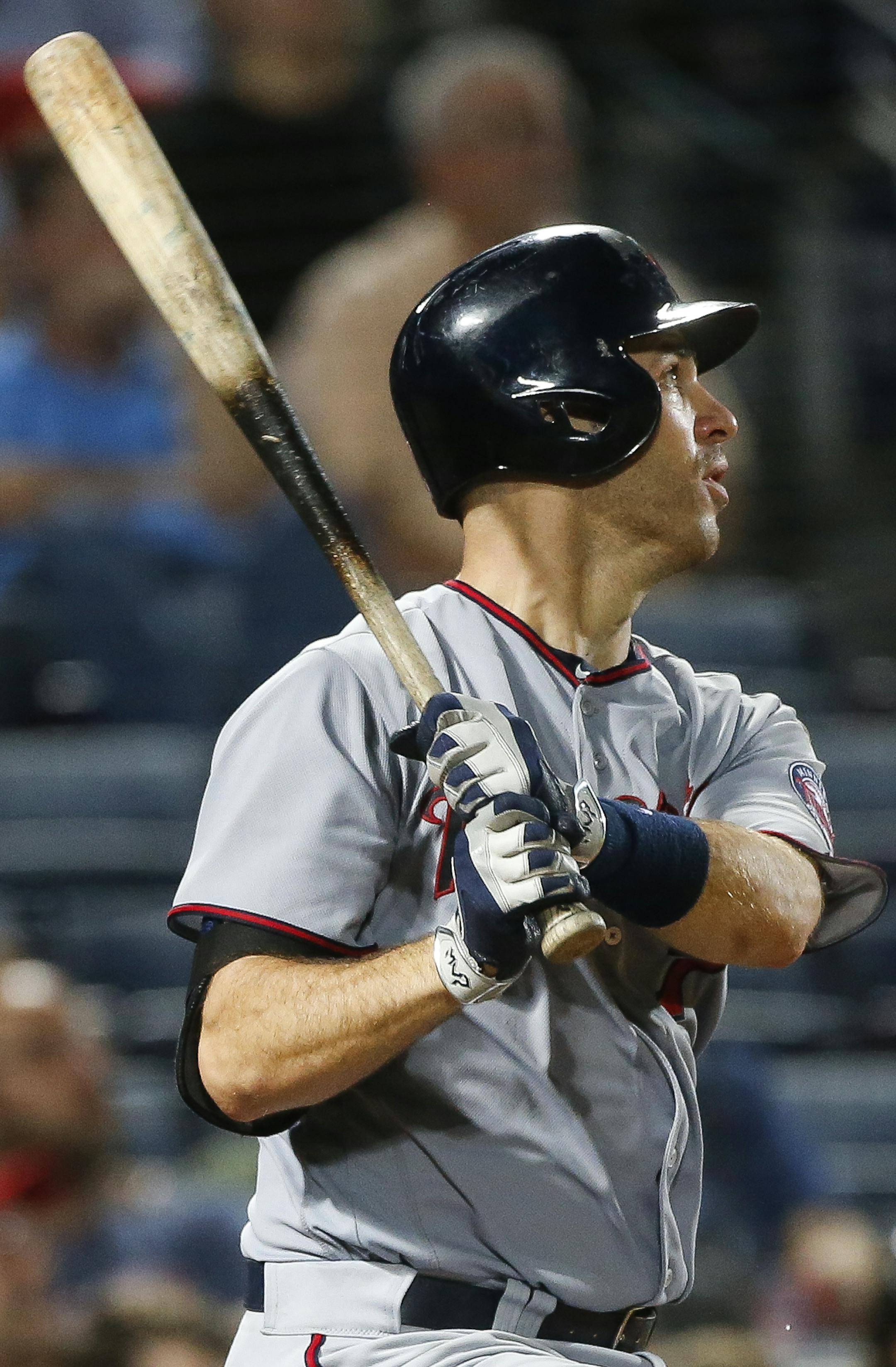 Minnesota Twins' Joe Mauer watches his solo home run during the eighth inning of a baseball game against the Atlanta Braves in Atlanta, Tuesday, Aug. 16, 2016. (AP Photo/John Bazemore)