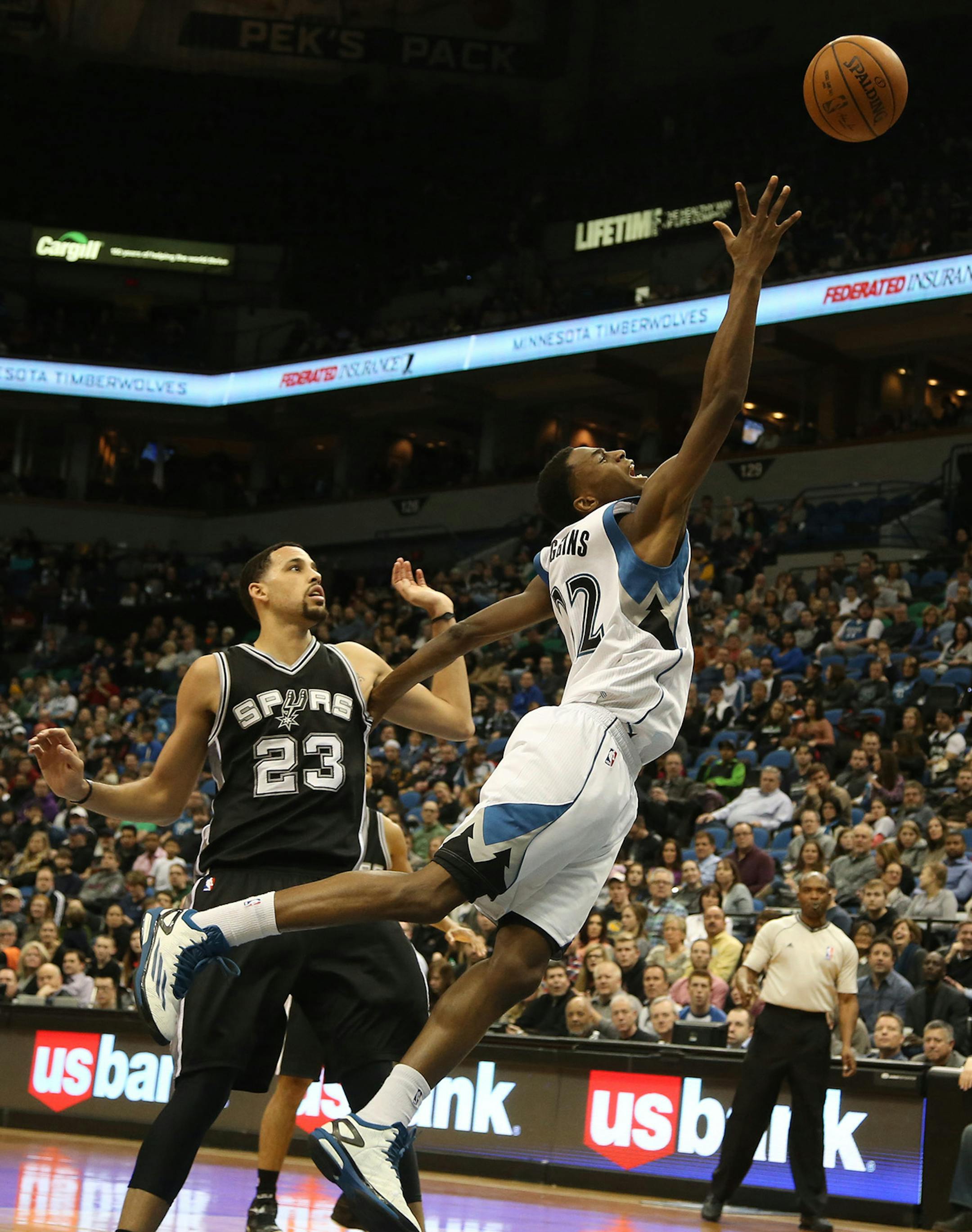 The Wolves Andrew Wiggins got fouled going to the basketball by Spurs Austin Daye during the second half. ] (KYNDELL HARKNESS/STAR TRIBUNE) kyndell.harkness@startribune.com Timberwolves vs San Antonio at the Target Center in Minneapolis Min., Saturday, January 10, 2014. Spurs won over the Wolves 108-93.