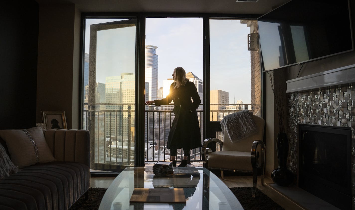 Real estate agent Pauline Olsen looked from a balcony in a condominium she is listing in downtown Minneapolis, where listings now outpace sales.