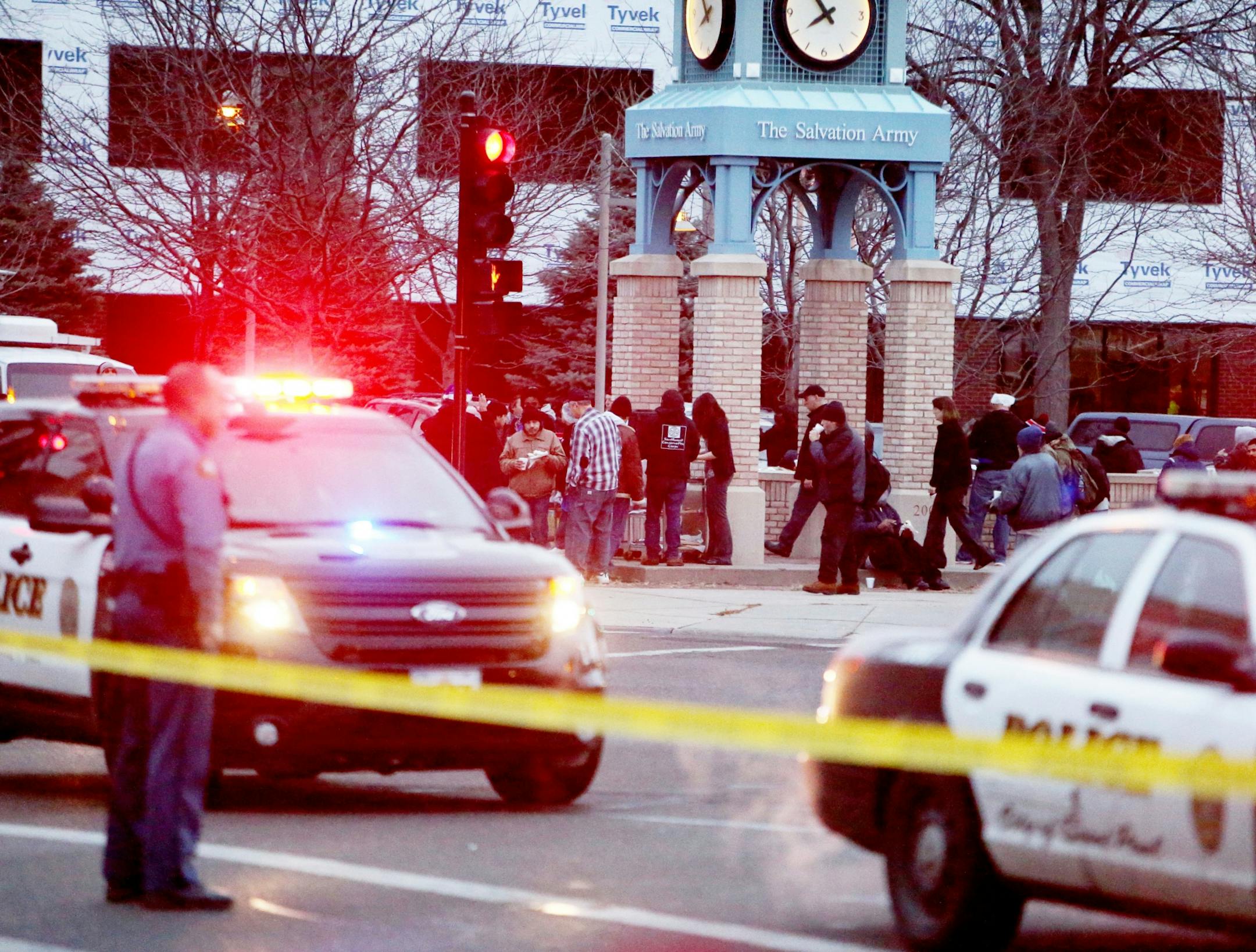 Scene of an early morning homicide where two persons are dead and a third critically wounded near the Salvation Army at 7th St and Smith Ave. Thursday, Dec. 10, 2015, in St. Paul, MN. Homeless and others who normally gather at the Salvation Army for breakfast were forced to the corner of Smith and 7th St. as the investigation was ongoing.