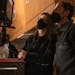 photograph of filmmakers Tricia Cooke and Ethan Coen, masked, on set