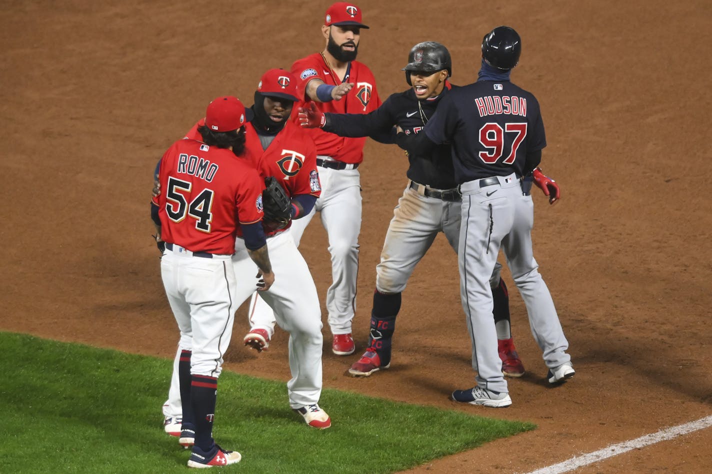 Minnesota Twins relief pitcher Sergio Romo (54) and Cleveland Indians shortstop Francisco Lindor (12) had to be separated by teammates after getting into a verbal altercation at the end of the top of the eighth inning Friday night. ] aaron.lavinsky@startribune.com The Minnesota Twins played the Cleveland Indians on Friday, Sept. 11, 2020 at Target Field in Minneapolis, Minn.