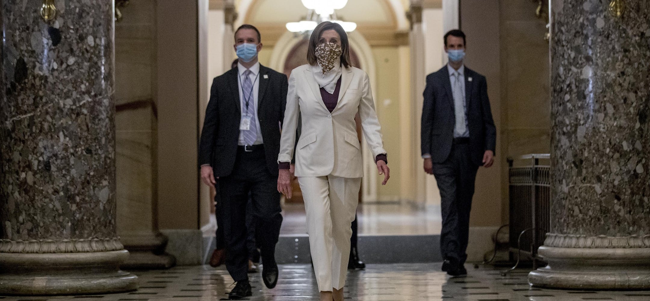 FILE - In this April 23, 2020, file photo House Speaker Nancy Pelosi of Calif., walks to her office after signing the Paycheck Protection Program and Health Care Enhancement Act, H.R. 266, after it passed the House on Capitol Hill in Washington. Pelosi shelved a proposal for proxy voting this week after Republicans objected. (AP Photo/Andrew Harnik, File)