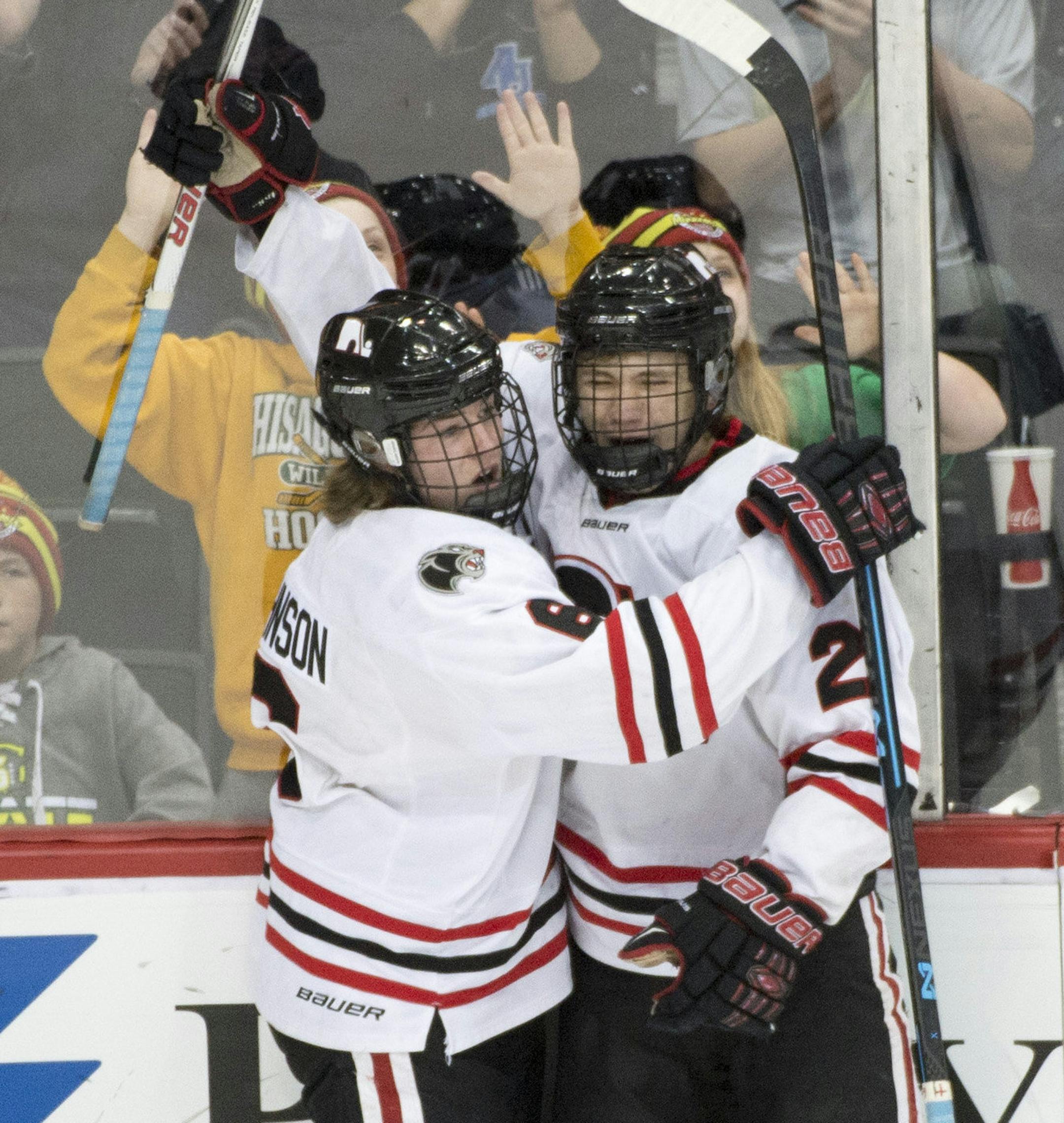 Lakeville North forward Max Johnson (6) and forward Henry Enebak (21) celebrate a goal by Enebak mid way through the first period. ] (Aaron Lavinsky | StarTribune) Eden Prairie plays Lakeville North in the Class 2A semifinals on Friday, March 6, 2015 at Xcel Energy Center.