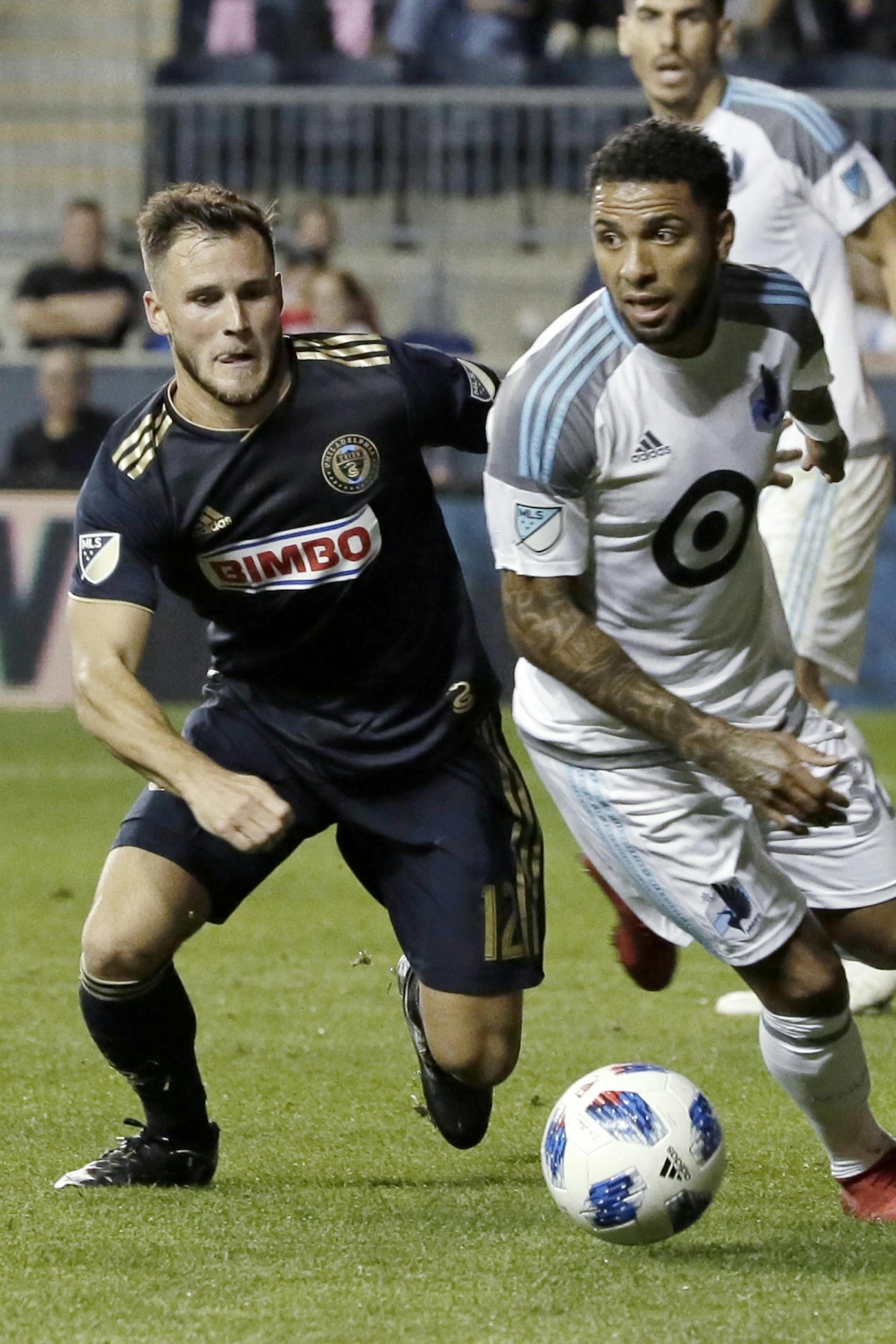 Union's # 12 Keegan Rosenberry and United's # 32 Alexi Gomez chase the ball in the 2nd half of the Minnesota United at Philadelphia Union MLS match at Talen Energy Stadium in Chester, Pa. on October 6, 2018. MANDATORY CREDIT: ELIZABETH ROBERTSON / Staff Photographer
