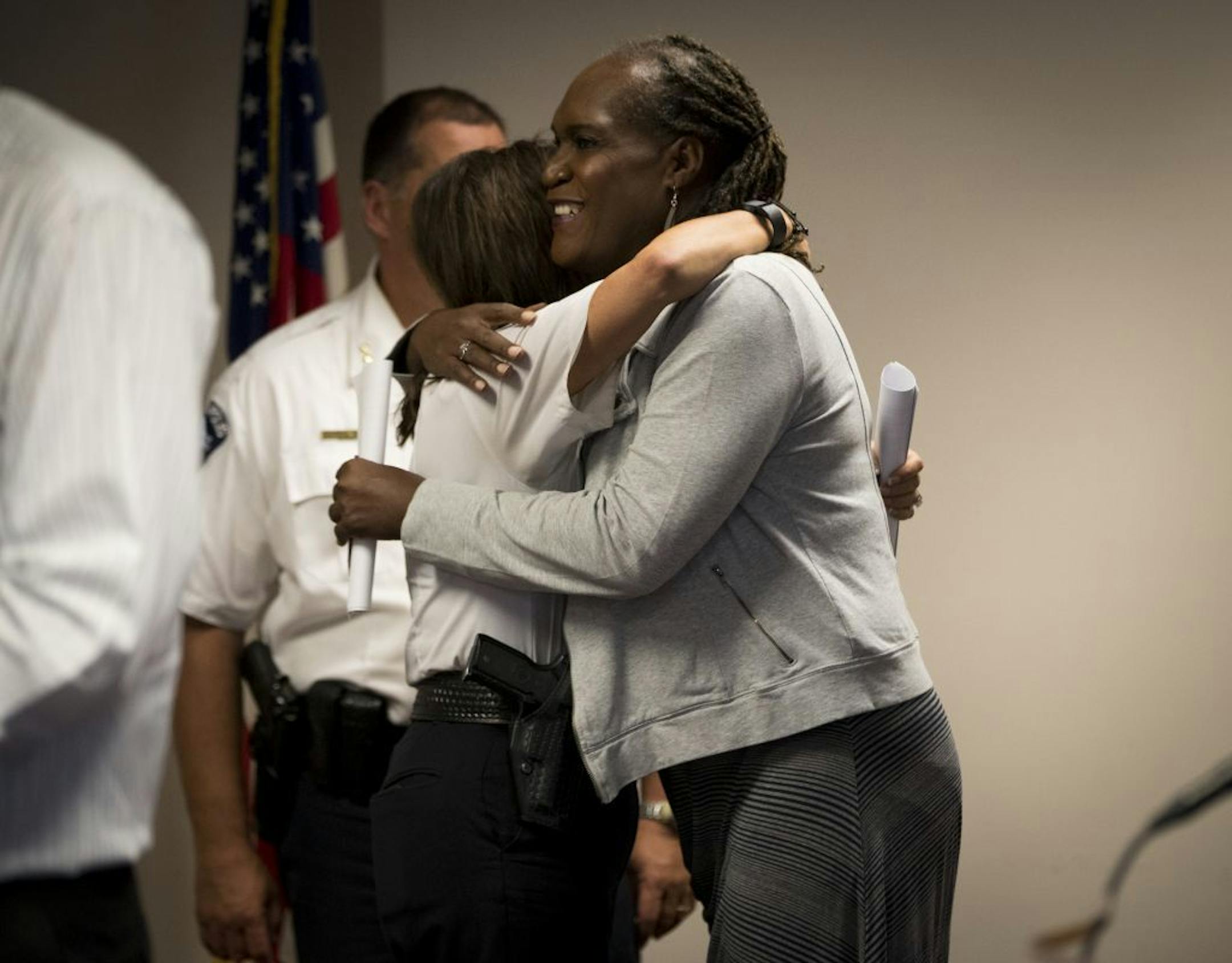 Andrea Jenkins, of the Transgender Oral History Project at the University of Minnesota, hugged Chief Jan�e Harteau after a press conference about the Minneapolis Police Department's transgender and gender non-conforming individuals policy at City Hall in Minneapolis, Minn., on Wednesday, September 21, 2016.