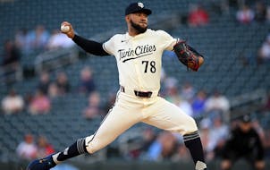 Minnesota Twins pitcher Simeon Woods Richardson throws a pitch against the Seattle Mariners in the top of the first inning Monday night at Target Fiel