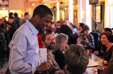 Candidate Melvin Carter III chats with the attendees inside the Ward 6 restaurant before the forum begins.
