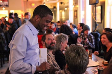 Candidate Melvin Carter III chats with the attendees inside the Ward 6 restaurant before the forum begins.