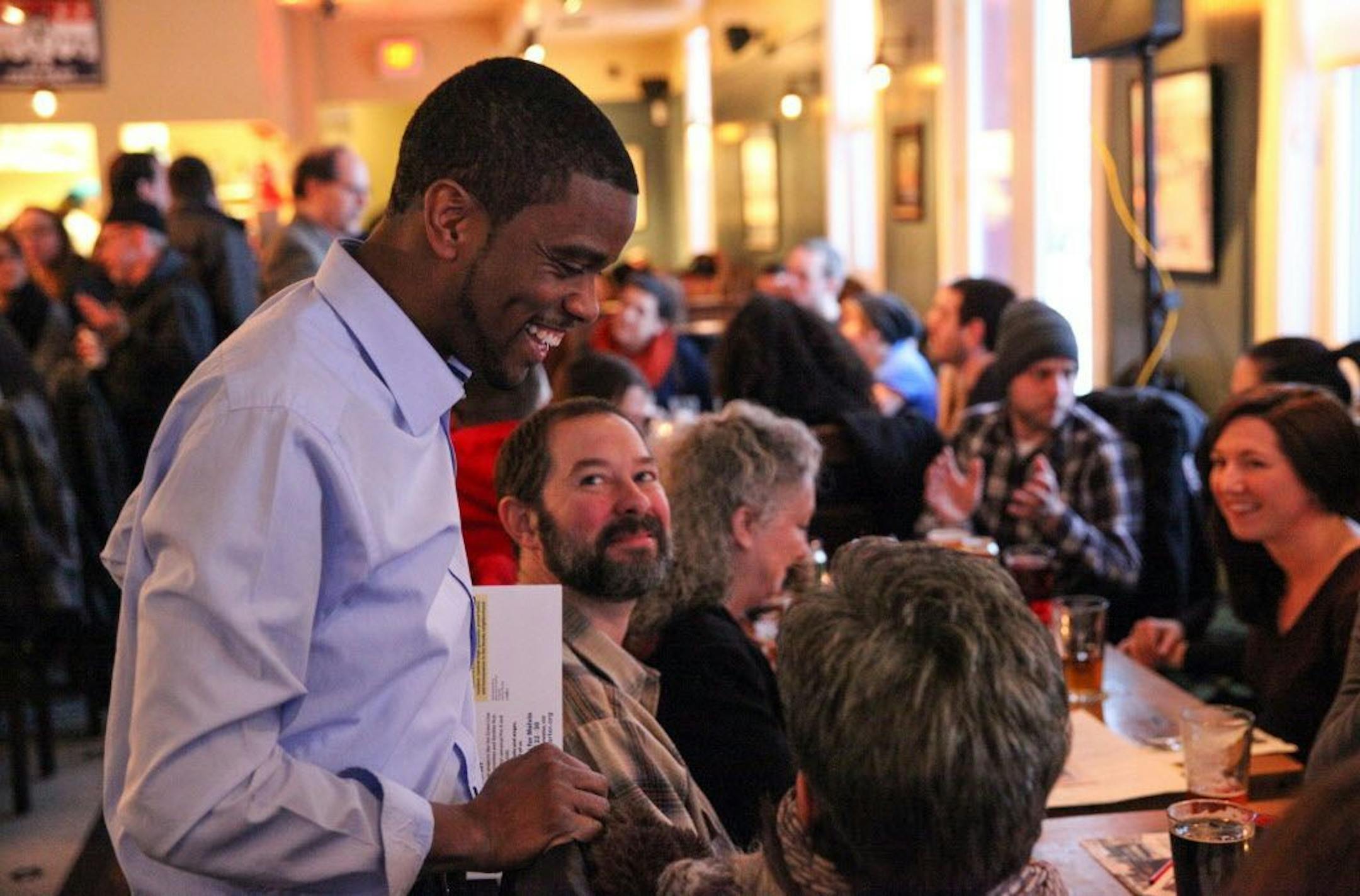 Candidate Melvin Carter III chats with the attendees inside the Ward 6 restaurant before the forum begins.