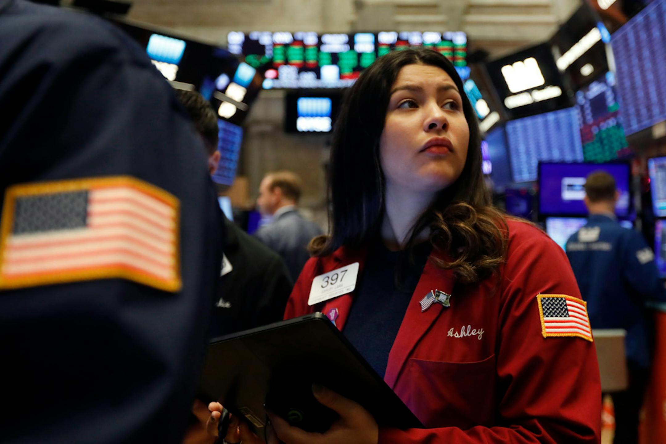 Trader Ashley Lara works on the floor of the New York Stock Exchange on Dec. 13.