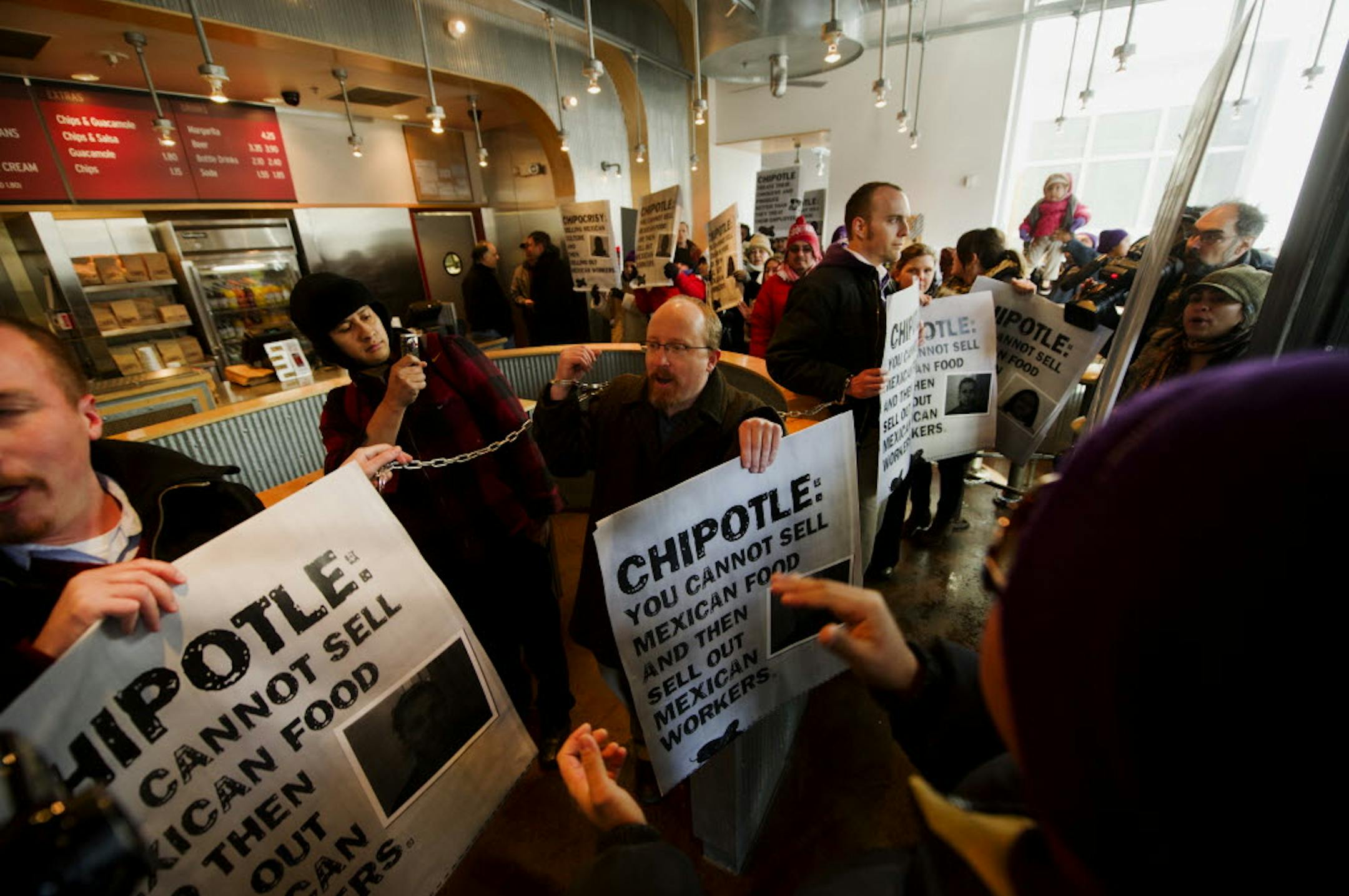 Former Chipotle workers were chained together inside a Chipotle Mexican Grill in downtown Minneapolis Jan. 20.