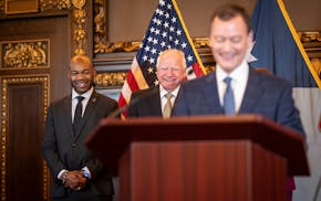 Gov. Tim Walz laughes as Jeff Johnson mentions the last time him and Gov. Tim Walz spoke was when he conceeded to him in the governors race in 2016 as