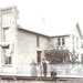 Catherine and H. E. Westerman, circa 1905, with sons Henry, Fred, Elmer, Arnold and Alvin and the original Westerman Lumber Co. building in Montgomery