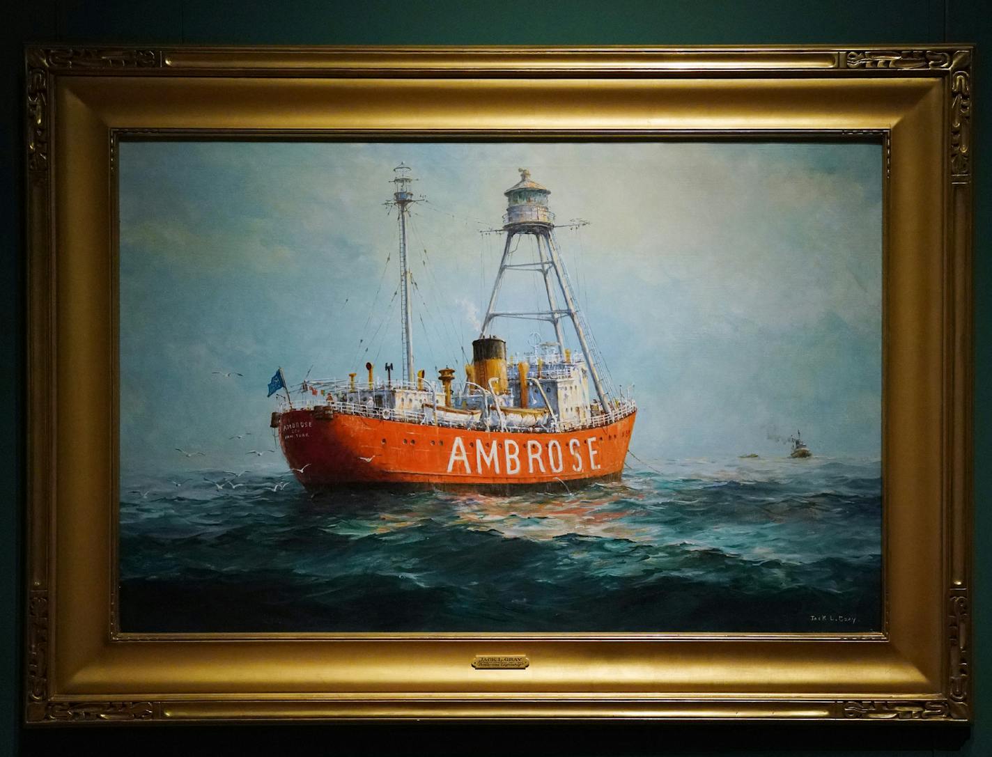 The painting "Ambrose Lightship" by Jack Gray hung in the Minnesota Marine Art Museum's new show "This is New York" Saturday. ] ANTHONY SOUFFLE &#xef; anthony.souffle@startribune.com Jon Swanson, curator of collections and exhibits at the Minnesota Marine Art Museum, installed pieces from the museum's new show "This is New York" Saturday, Sept. 29, 2018 in Winona, Minn.