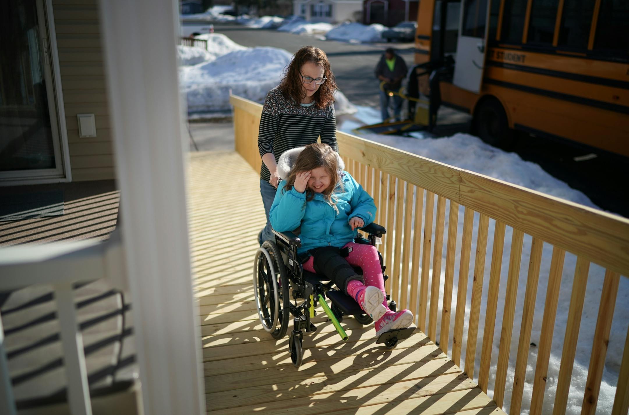 Linsey Rippy pushed her youngest daughter Sydney, 9, up the wheelchair ramp to their home after getting her from the school bus after school. Sydney, 9, is a 3rd grader.