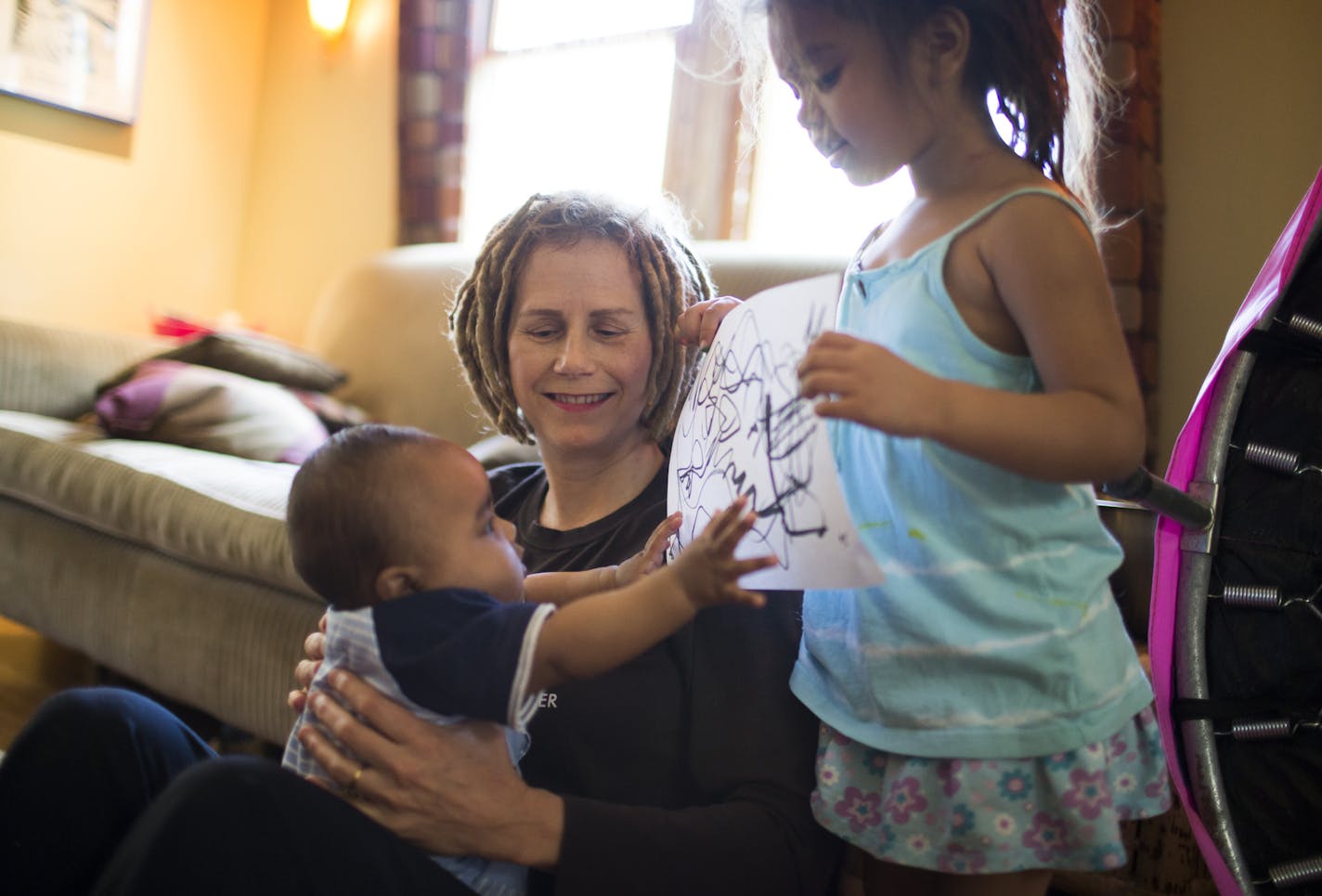 Hannah Lieder sat with her foster son Louis as her foster daughter Alena showed off some of her artwork on Monday, May 4, 2015, in Minneapolis, Minn. ] RENEE JONES SCHNEIDER &#x2022; reneejones@startribune.com