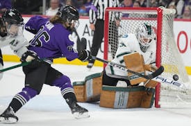 Minnesota's Michela Cava (86) attempts to score on Boston goalie Aerie Frankel in the first period in Game 4 of the PWHL Walter Cup finals at Xcel Cen
