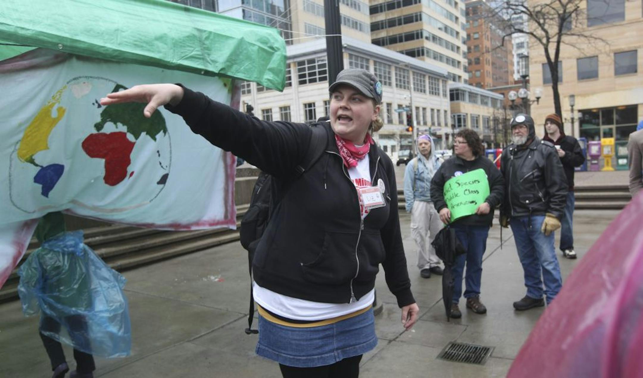 Liz Dahl talked to the crowd of about 30 participants about the small march they were going to conduct during the first day back for Occupy Minnesota in Peavey Plaza in Minneapolis Min., Saturday, April 7, 2012.