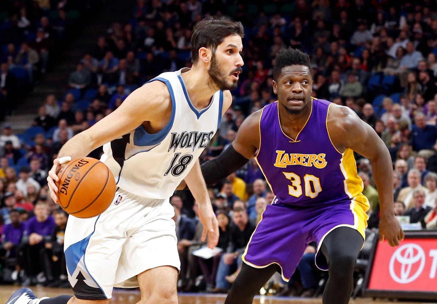 Minnesota Timberwolves' Omri Casspi, left, drives past Los Angeles Lakers' Julius Randle during the first half of an NBA basketball game Thursday, March 30, 2017, in Minneapolis. (AP Photo/Jim Mone)