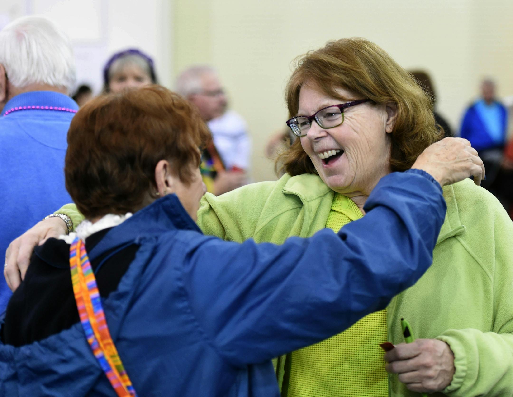 Cynthia Frank, left, from Delaware, hugged her friend Margaret Vitek of Alexandria, Minn., in January at the Winter Guest Fest in Fort Walton Beach, Fla. Hugging also can help relieve stress and depression.